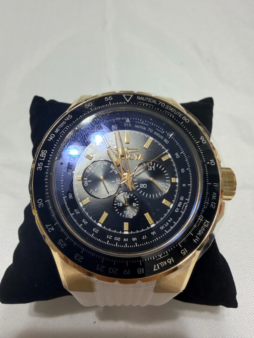 Invicta Gold-Tone Chronograph Watch with Black Dial and White band